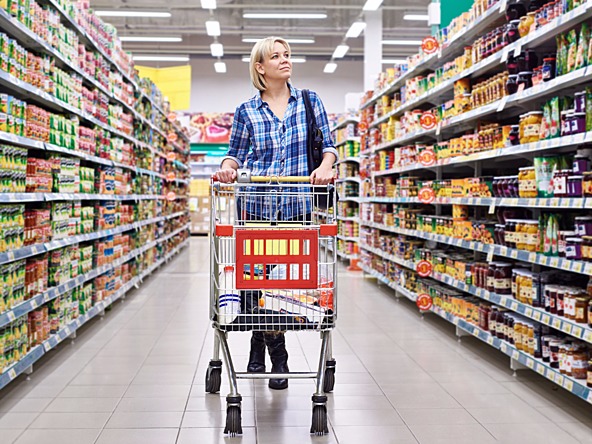 Woman shopping supermarket trolley_crop